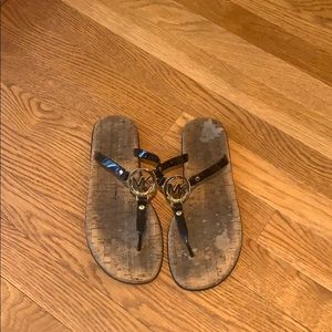 Michael Kors flip flops sandals black and gold